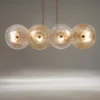 LAMPA WISZĄCA, elegancka, złota konstrukcja, szklane koła z ozdobnymi żłobieniami