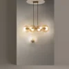 LAMPA WISZĄCA, elegancka, złota konstrukcja, szklane koła z ozdobnymi żłobieniami
