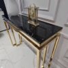 KONSOLA-na-zlotym-blyszczacym-stelazu-Castillo-z-czarnym-blatem-z-konglomeratu-marmurowego-nowoczesne-glamour-ekskluzywna.jpg KONSOLA-na-zlotym-blyszczacym-stelazu-Castillo-z-czarnym-blatem-z-konglomeratu-marmurowego-nowoczesne-glamour-ekskluzywna.jpg